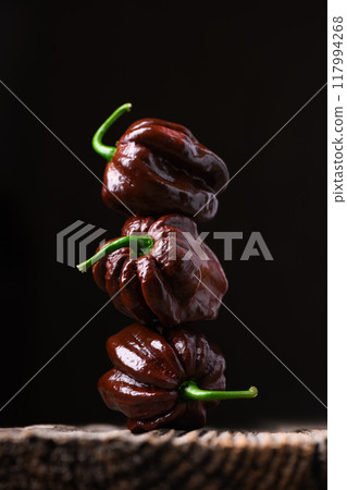 Tower from ripened chocolate habanero peppers Tower from ripened chocolate habanero peppers 117994268