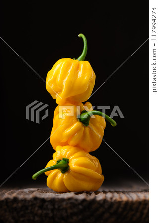 Tower from ripened yellow habanero peppers Tower from ripened yellow habanero peppers 117994273