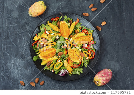 Salad of cactus fruits, peppers and almonds. Salad of cactus fruits, peppers and almonds. 117995781
