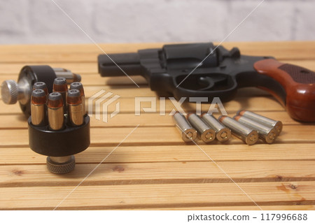 Vintage Revolver Gun With Ammunition and Speed Loader Vintage Revolver Gun With Ammunition and Speed Loader 117996688