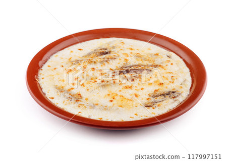 Delicious baked fish with cream cheese sauce on plate Delicious baked fish with cream cheese sauce on plate 117997151