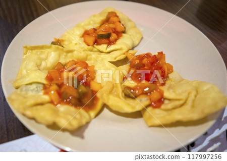 This is a table setting of delicious local Vietnamese food. This is a table setting of delicious local Vietnamese food. 117997256