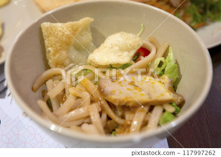 This is a table setting of delicious local Vietnamese food. 117997262