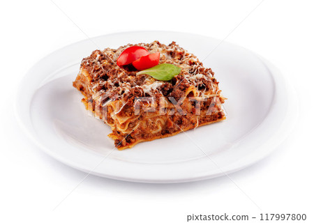 Portion of lasagna sitting on a white plate Portion of lasagna sitting on a white plate 117997800