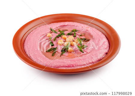 Beetroot hummus decorated with chickpeas and green onions in a clay dish Beetroot hummus decorated with chickpeas and green onions in a clay dish 117998029