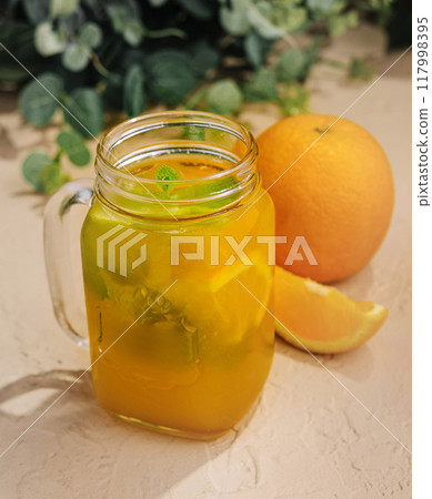 Fresh orange iced tea in mason jar 117998395