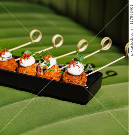 Gourmet appetizers on elegant display Gourmet appetizers on elegant display 117998401