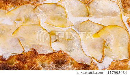 Fresh homemade pear and cheese pizza on cutting board 117998484