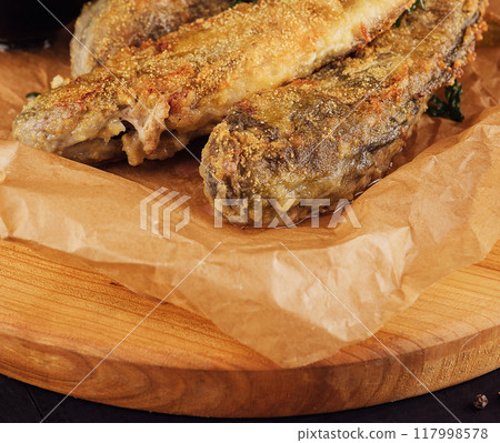 Grilled fish steaks on wooden board Grilled fish steaks on wooden board 117998578