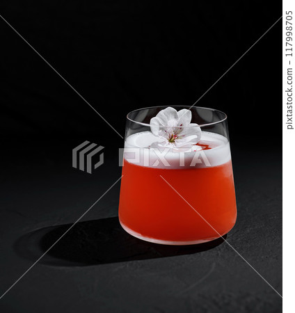 Elegant cocktail with blossom garnish Elegant cocktail with blossom garnish 117998705