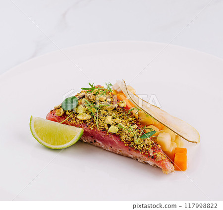 Gourmet tuna tartare with fresh herbs and lime 117998822