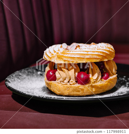 Gourmet paris-brest pastry on elegant plate 117998911