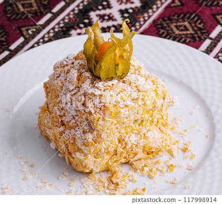 Traditional middle eastern dessert on ornate tablecloth Traditional middle eastern dessert on ornate tablecloth 117998914