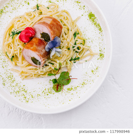 Gourmet stuffed chicken breast with spaghetti 117998946