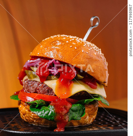 Gourmet burger on elegant serving tray Gourmet burger on elegant serving tray 117998967
