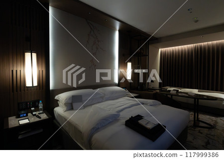 A room at night at the Ritz-Carlton Reserve, Higashiyama Niseko Village, a luxury resort hotel in Niseko, Hokkaido 117999386