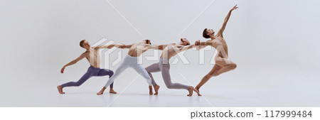 Banner. Dancers support each other, their bodies intertwined in sculptural pose that highlights their coordination and teamwork. 117999484