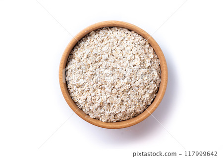 Rolled oats, healthy breakfast cereal oat flakes in bowl isolated on white background 117999642