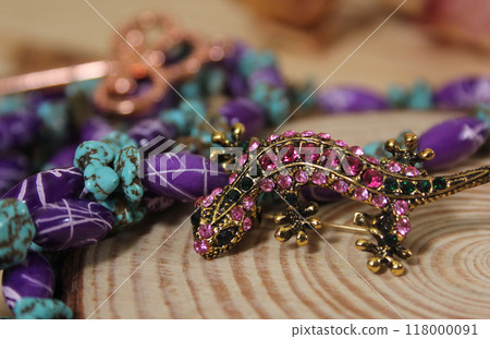 Southwestern Style Jewelry on Wooden Table With Rustic Decor 118000091