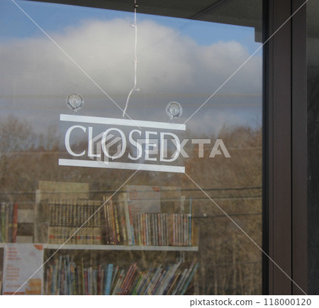 Closed Sign in Window of Public Library Closed Sign in Window of Public Library 118000120