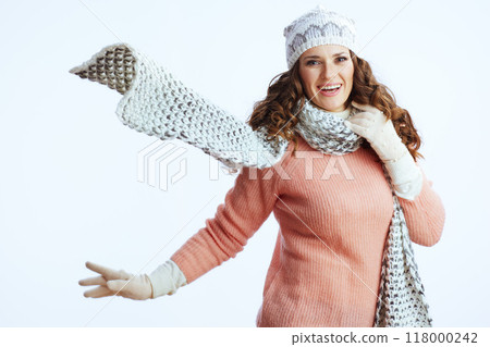 happy stylish woman in sweater, mittens, hat and scarf on white 118000242