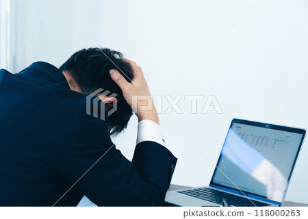 Male businessman scanning documents Male businessman scanning documents 118000263