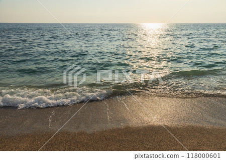 Coastal landscape with shore waves under sunset sky 118000601