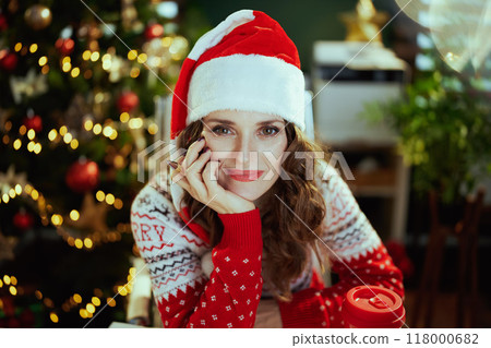 happy business woman in green office with Christmas tree 118000682