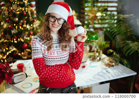 happy business woman in green office with Christmas tree 118000700