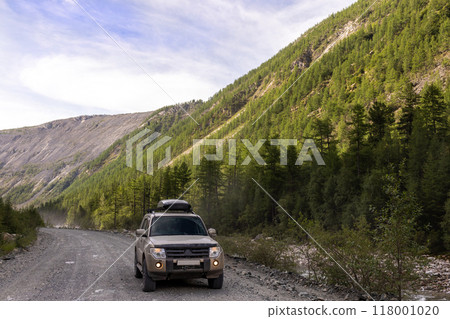 Japanese SUV near a mountain river Japanese SUV near a mountain river 118001020