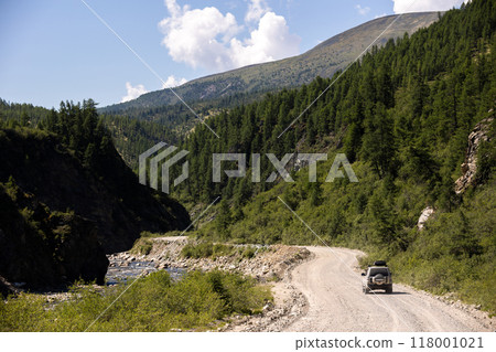 Japanese SUV on the road near a mountain river 118001021