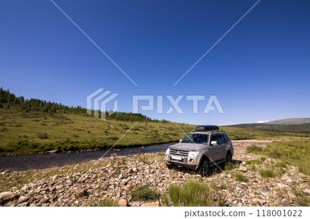 Japanese SUV near a mountain river 118001022