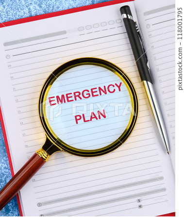 Conceptual emergency plan symbol. Copy space. Emergency plan words written in an open notebook through a magnifying glass, top view Conceptual emergency plan symbol. Copy space. Emergency plan words written in an open notebook through a magnifying glass, top view 118001795