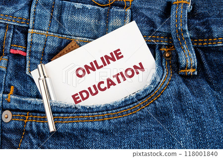 Copy space and business concept. ONLINE EDUCATION words on white card that appeared from the pocket of his jeans 118001840