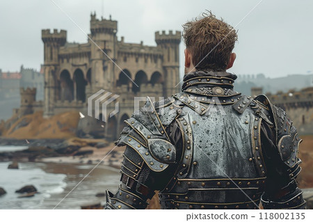 Medieval knight in steel armor against the background of castle walls. 118002135