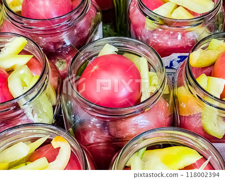 Glass jars with tomatoes for preservation. Canning vegetables at home. Organic products 118002394