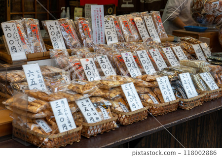 Rice crackers lined up in front of a retro rice cracker shop Rice crackers lined up in front of a retro rice cracker shop 118002886