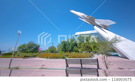 The MIG-21 plane is a monument in the square of Glory timelapse hyperlapse. Aktau, Kazakhstan 118003075