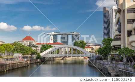 Skyline of Singapore financial district behind Elgin Bridge and the Singapore River timelapse hyperlapse 118003176