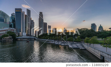 Singapore skyscrapers skyline with white Anderson Bridge near esplanade park day to night timelapse. 118003220
