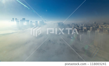 Skylines under the thick fog at the street timelapse of Abu Dhabi at morning 118003241