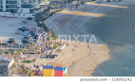 Beach on Al Reem island in Abu Dhabi during sunset timelapse from above. 118003242