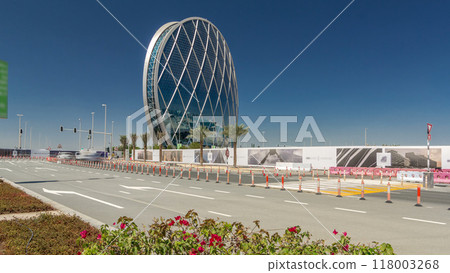 Circular skyscraper Aldar Headquarters Building timelapse hyperlapse in Abu Dhabi, UAE. 118003268