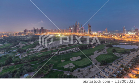 Dubai Marina skyscrapers and golf course night to day timelapse, Dubai, United Arab Emirates 118003325