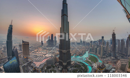 Panoramic skyline view of Dubai downtown during sunrise with mall, fountains and Burj Khalifa aerial morning timelapse 118003346