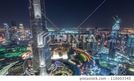 Panoramic skyline view of Dubai downtown with mall, fountains and Burj Khalifa aerial night timelapse Panoramic skyline view of Dubai downtown with mall, fountains and Burj Khalifa aerial night timelapse 118003348