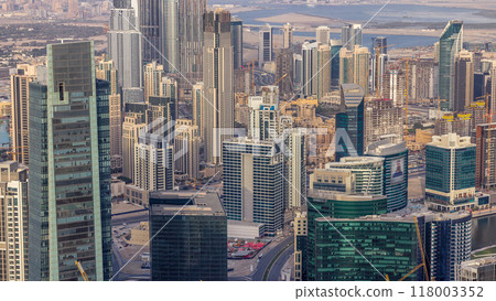 Panoramic aerial view of business bay towers in Dubai at evening timelapse. Panoramic aerial view of business bay towers in Dubai at evening timelapse. 118003352