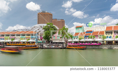Tourist boats docking at Clarke Quay harbor timelapse hyperlapse. 118003377