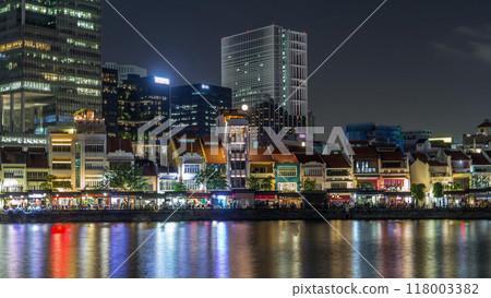 Singapore quay with tall skyscrapers in the central business district on Boat Quay night timelapse hyperlapse 118003382