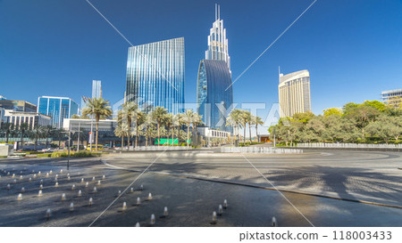 Fountains near main entrance to the tallest skyscraper timelapse hyperlapse, Dubai 118003433